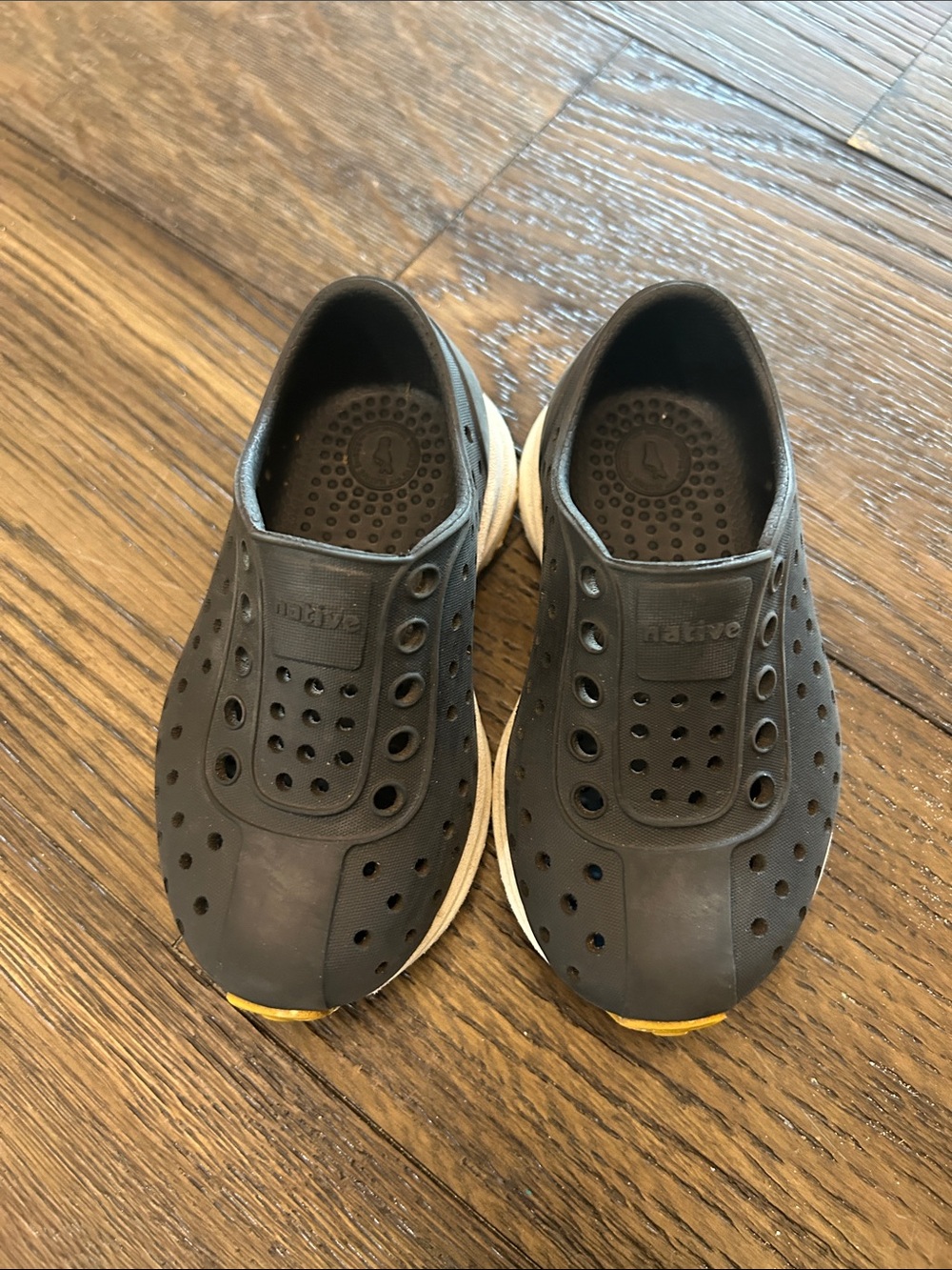 Native Men's Slip-On Perforated Water Shoes in Black with White Sole